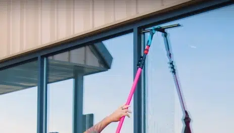 Window cleaners near me using professional tools to clean windows