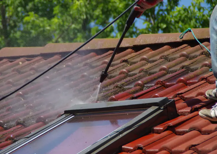 Professional technician ensuring safety during Roof Cleaning Services in Upton Park by AE Exterior Cleaning Ltd.
