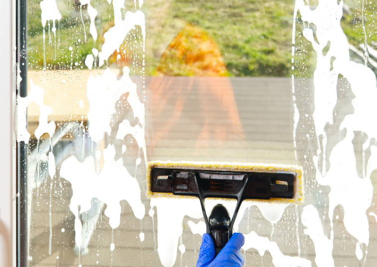 ae exterior cleaning ltd technician cleaning window in upton park for local